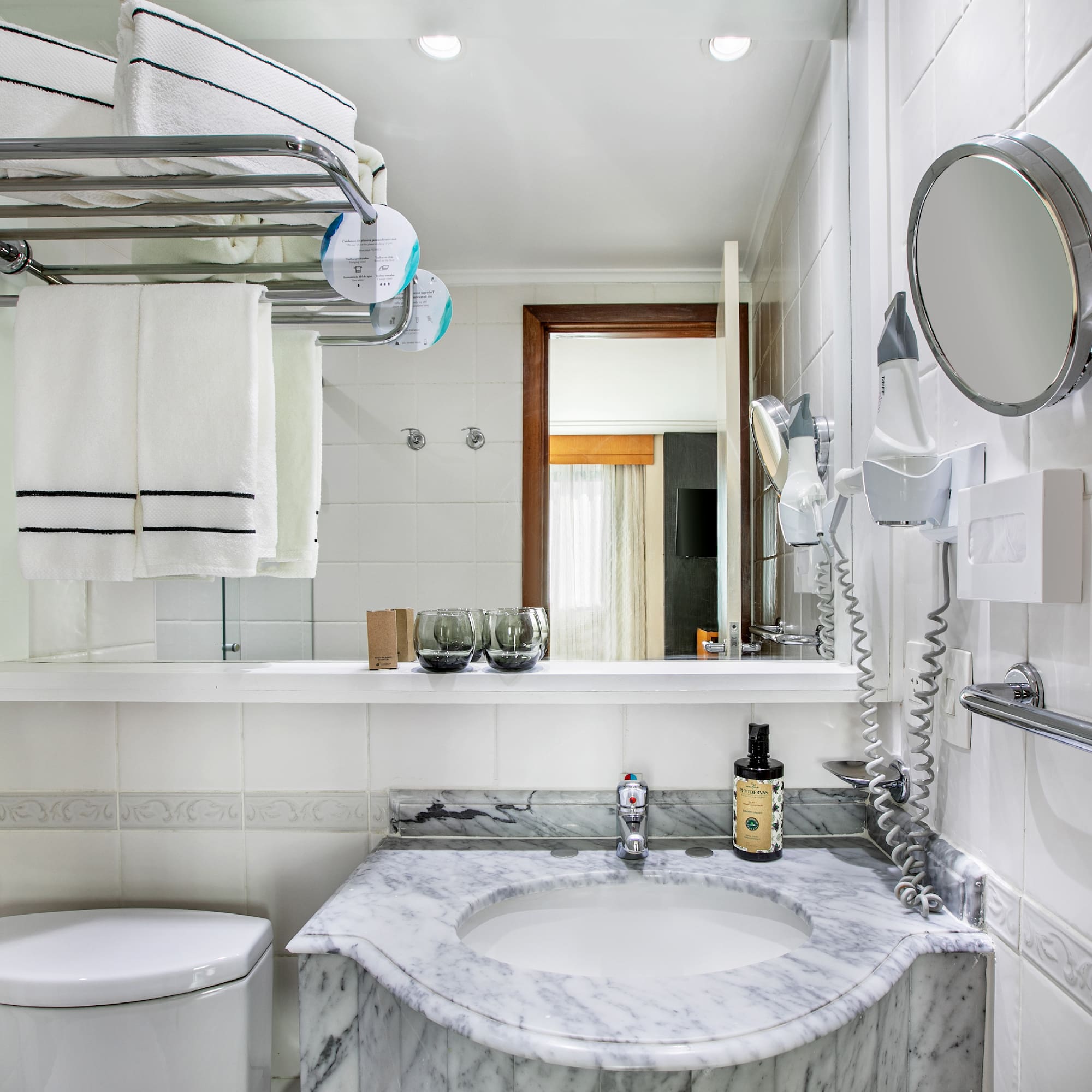 a bathroom with a sink toilet and a mirror