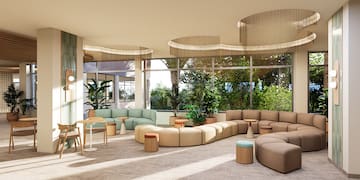 a room with large windows and a large couch