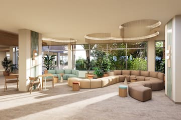 a room with large windows and a large couch