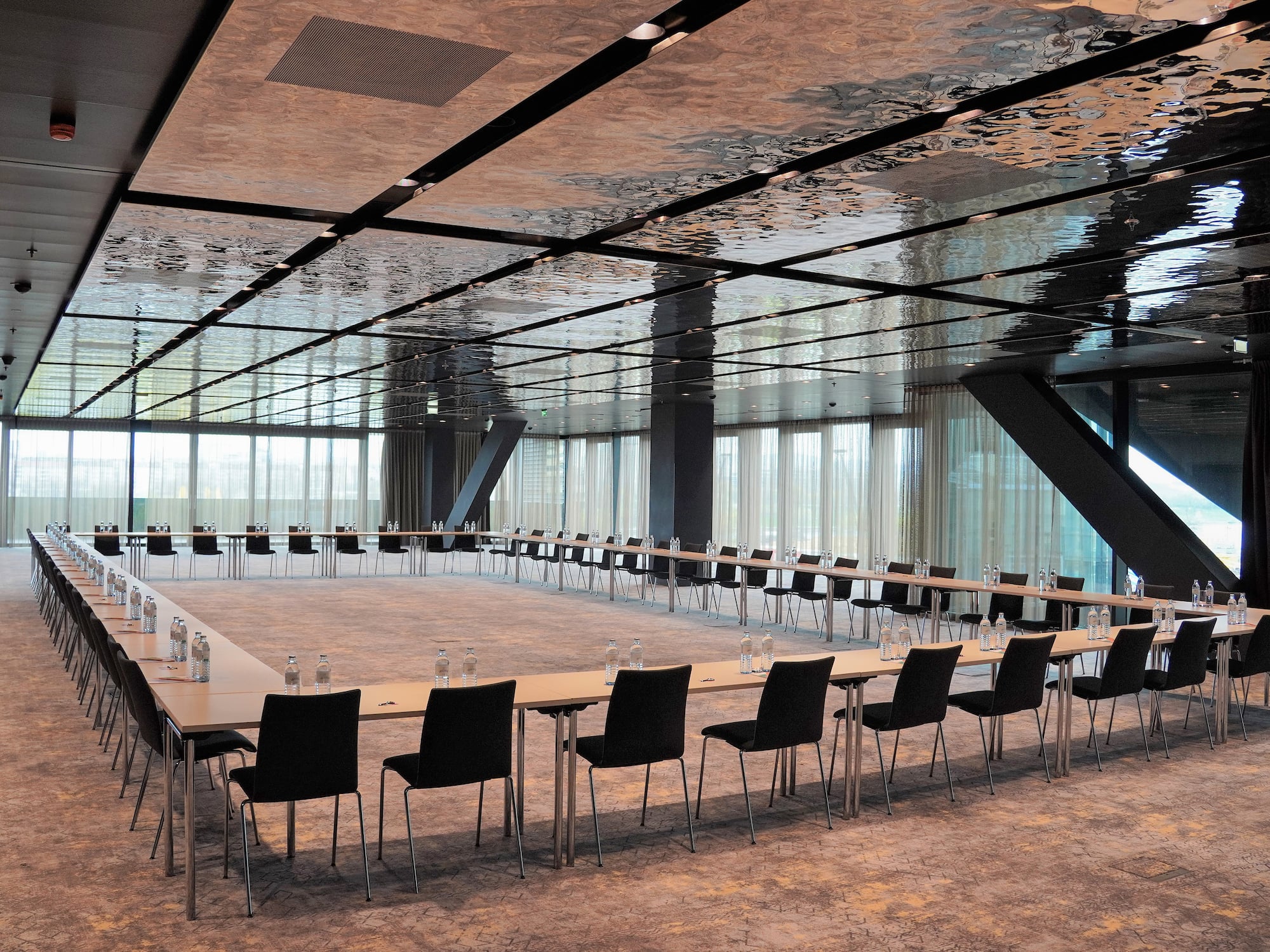 a large conference room with a long table and chairs.