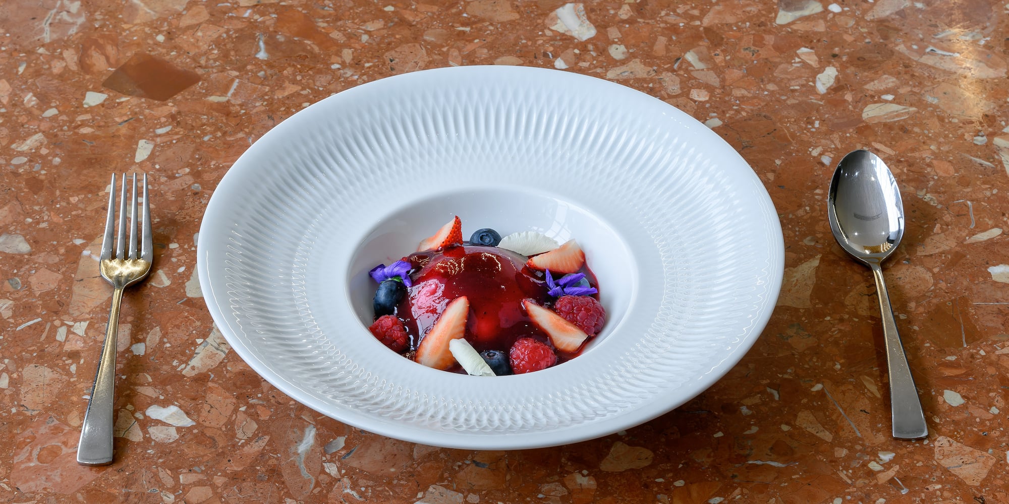 a plate of fruit dessert