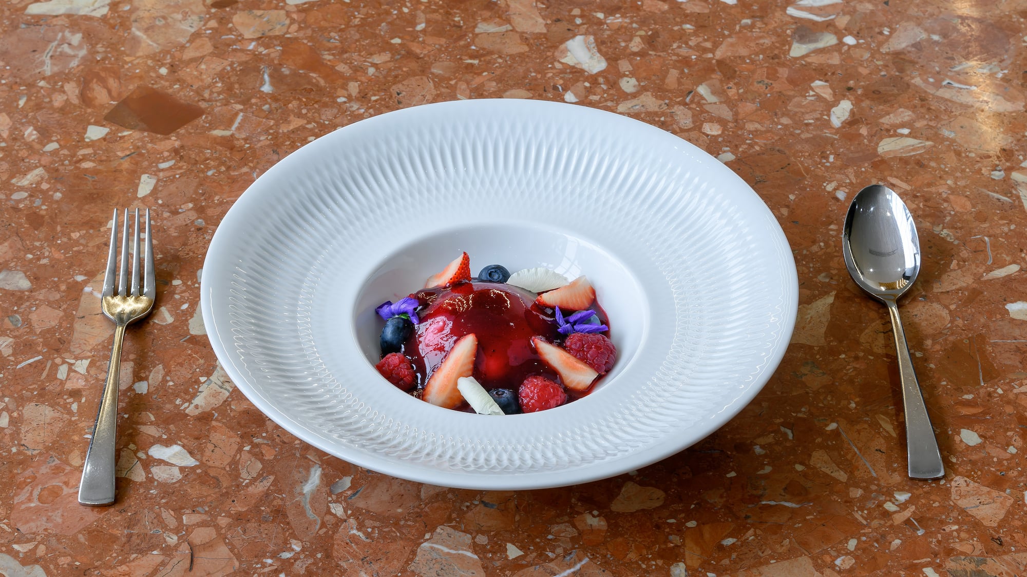 a plate of fruit dessert