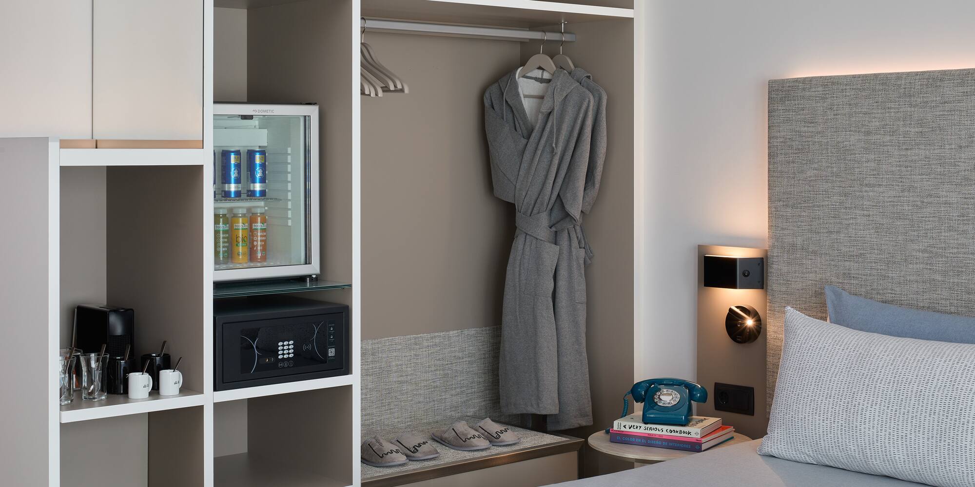 a room with a bed and a robe on a swinger