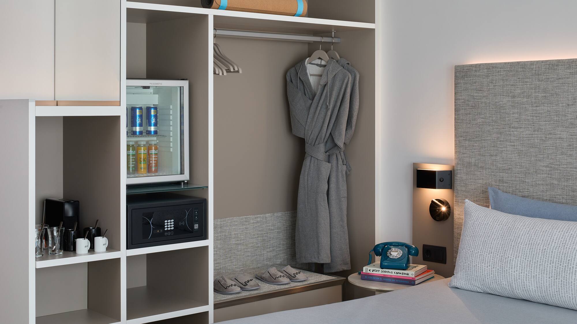 a room with a bed and a robe on a swinger