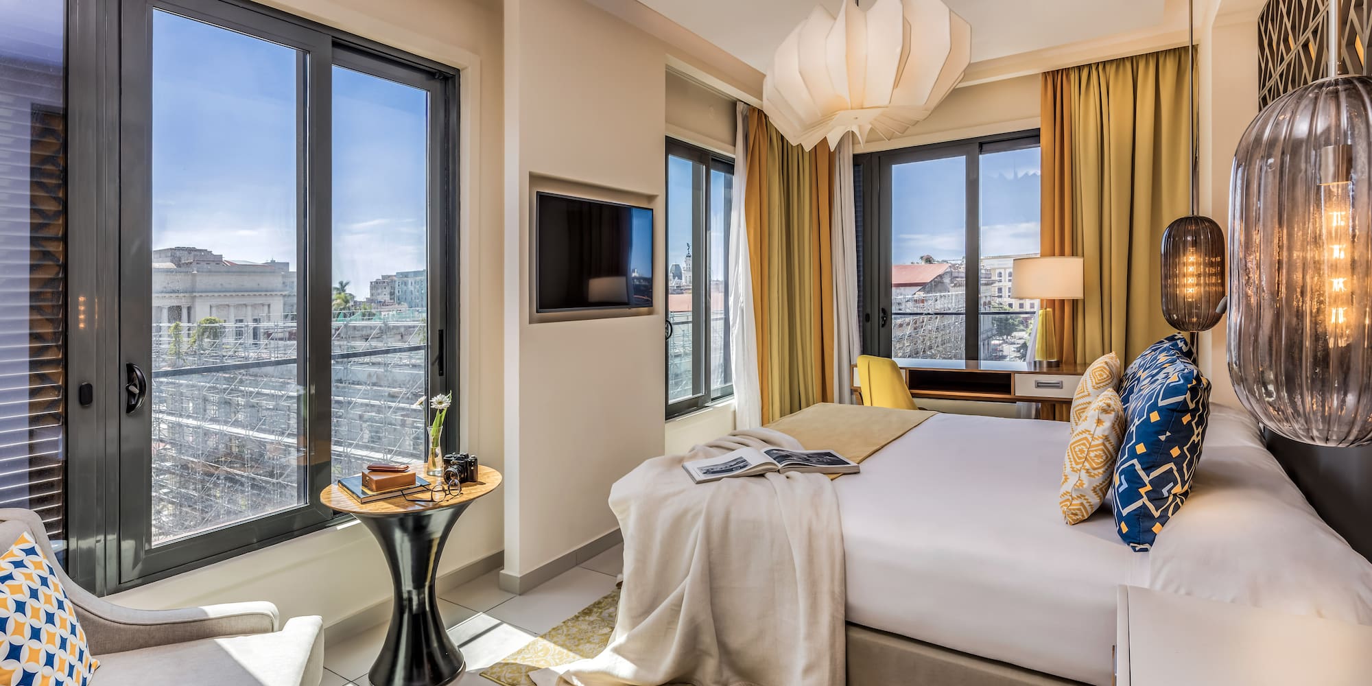 a bedroom with a bed and a tv