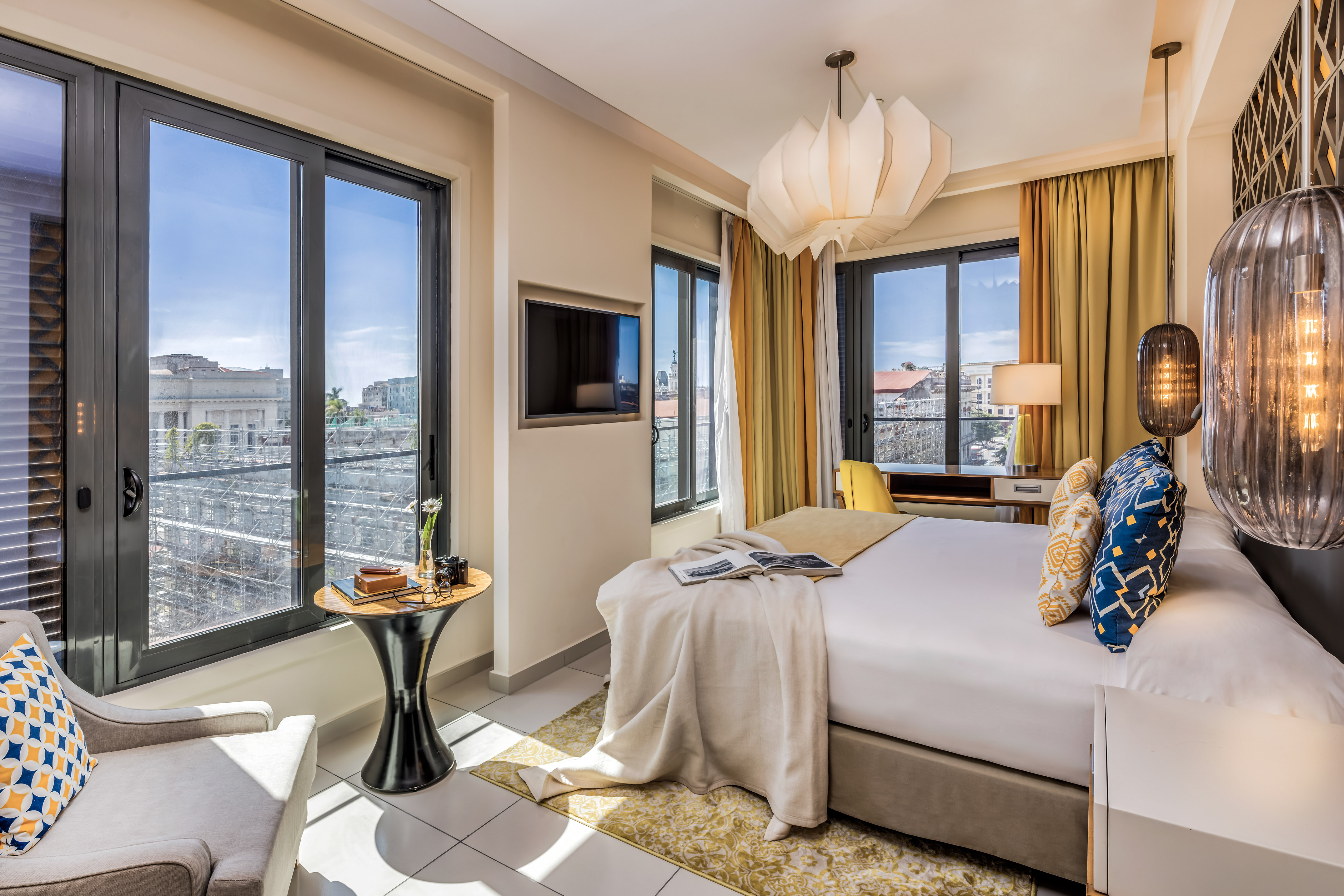 a bedroom with a bed and a tv