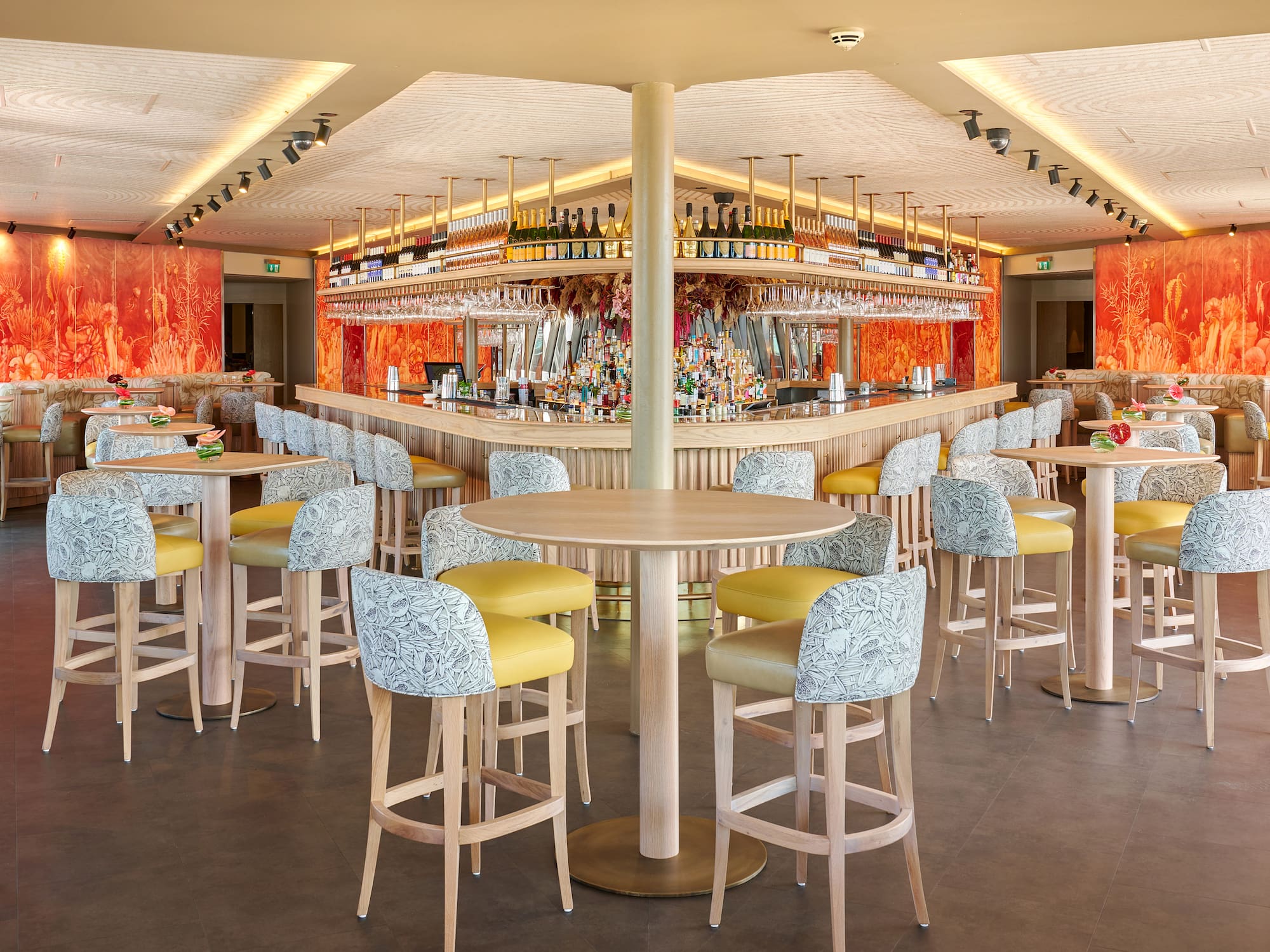 a bar with tables and chairs