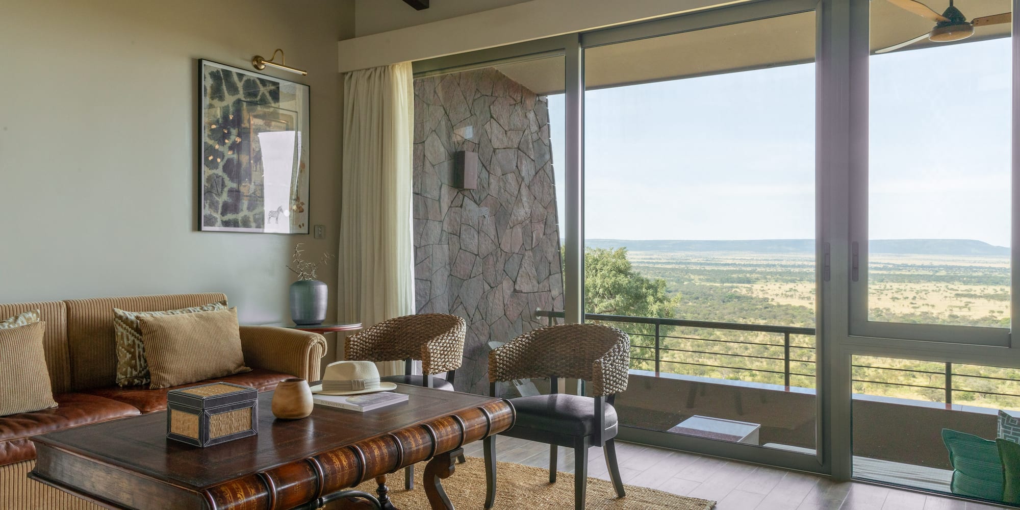 a living room with a table and chairs