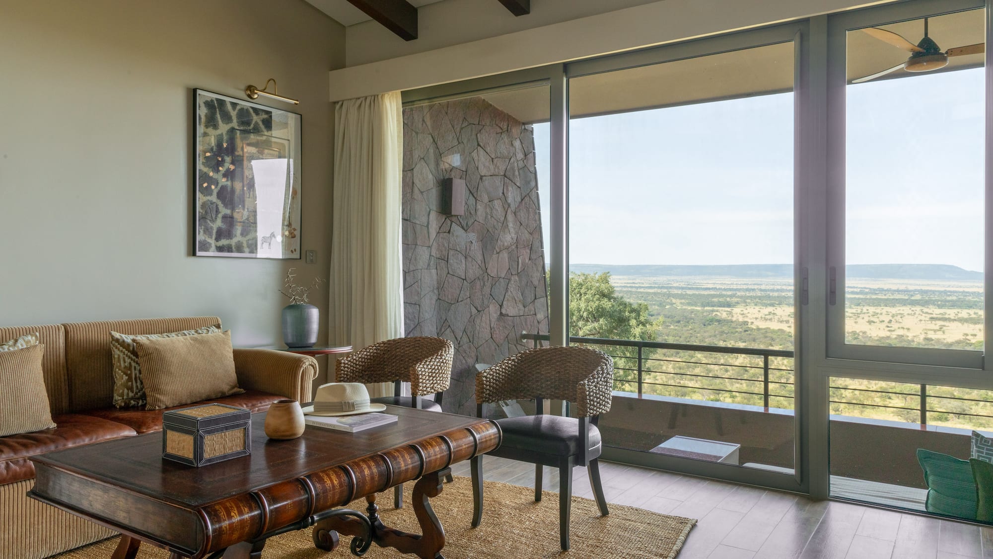a living room with a table and chairs