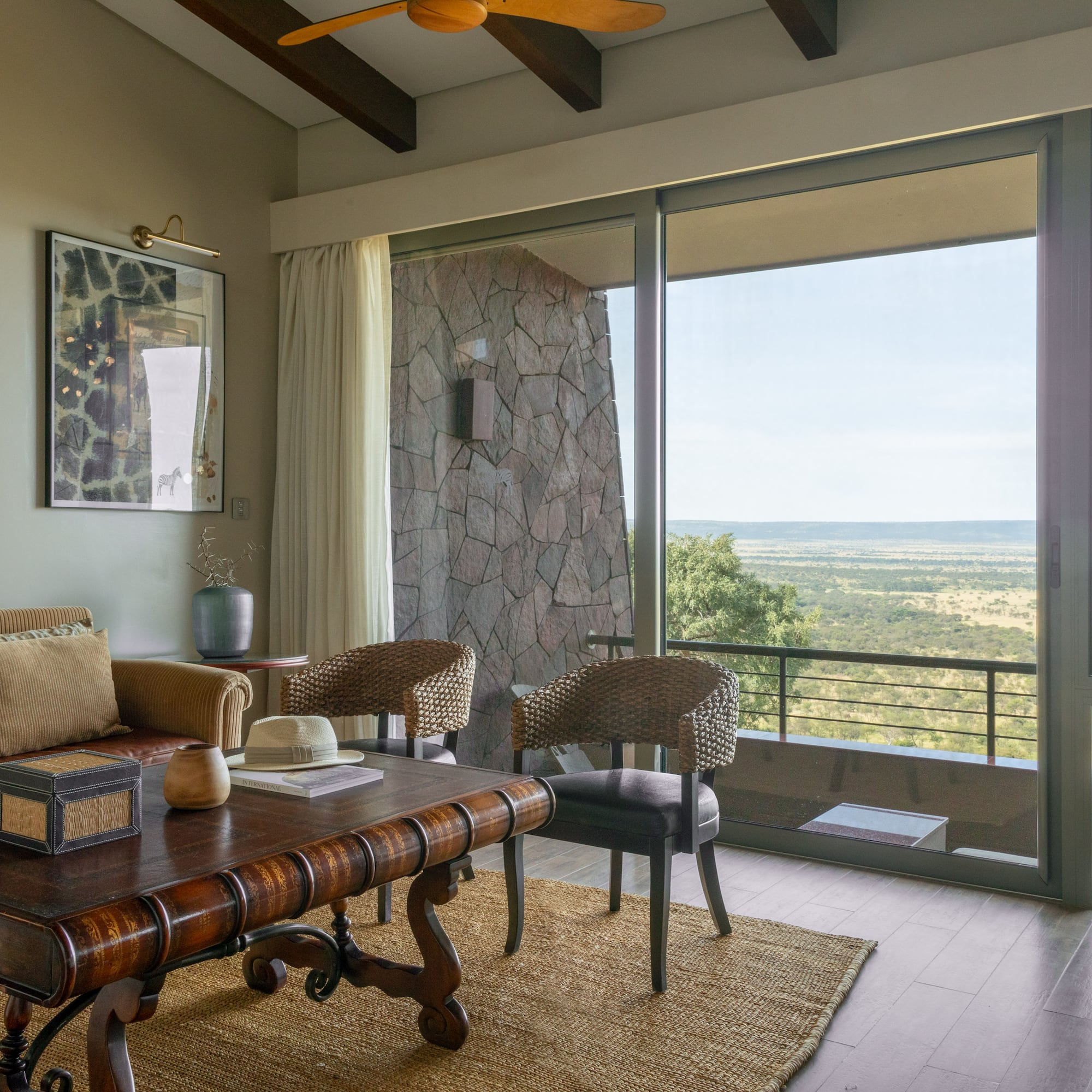 a living room with a table and chairs