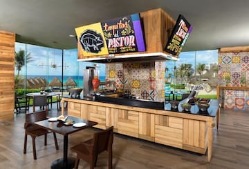 a restaurant with tables and chairs