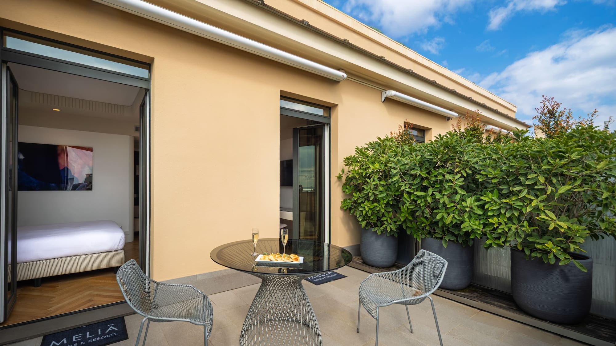 a patio with a table and chairs