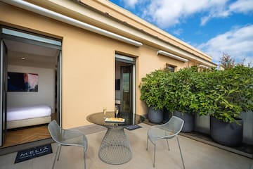 a patio with a table and chairs
