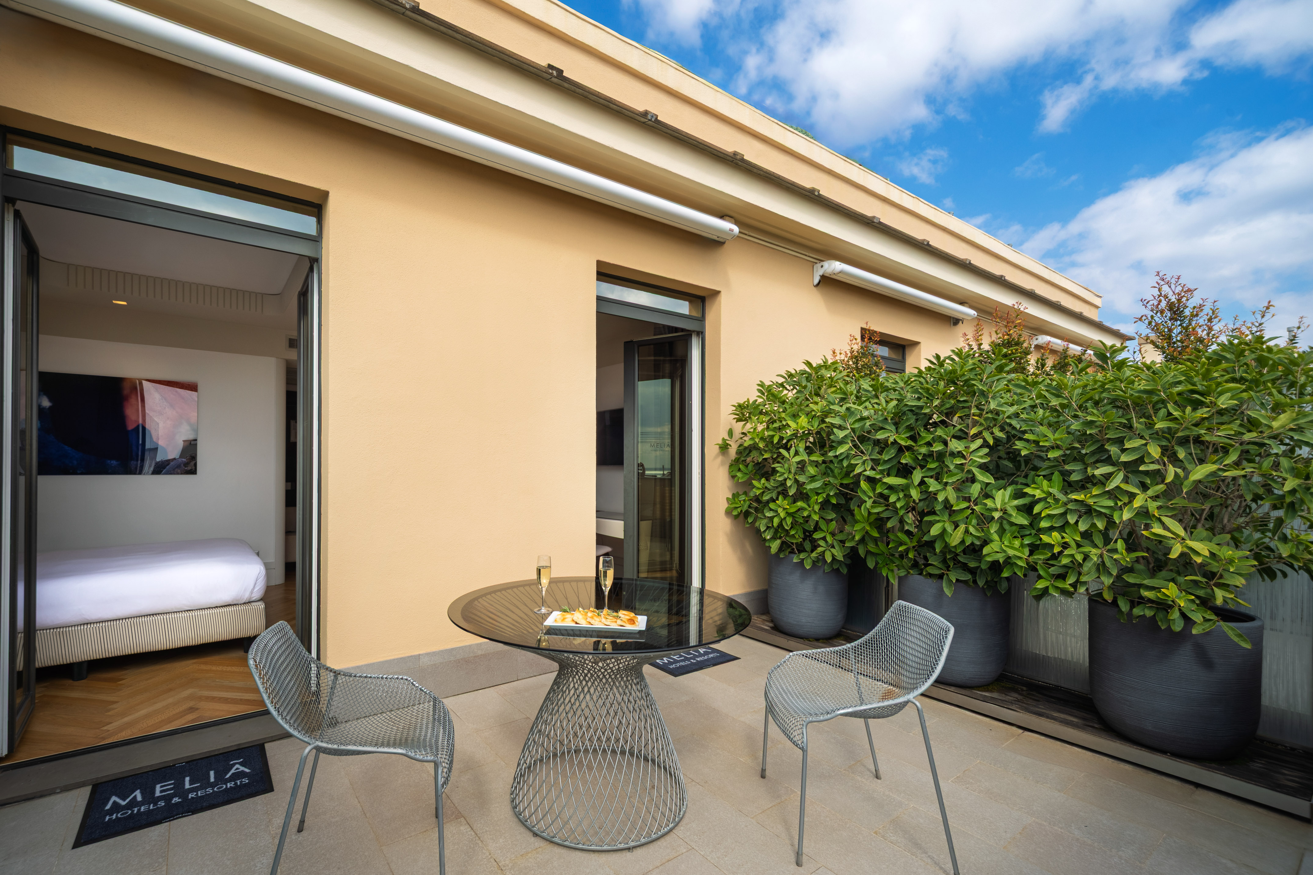 a patio with a table and chairs