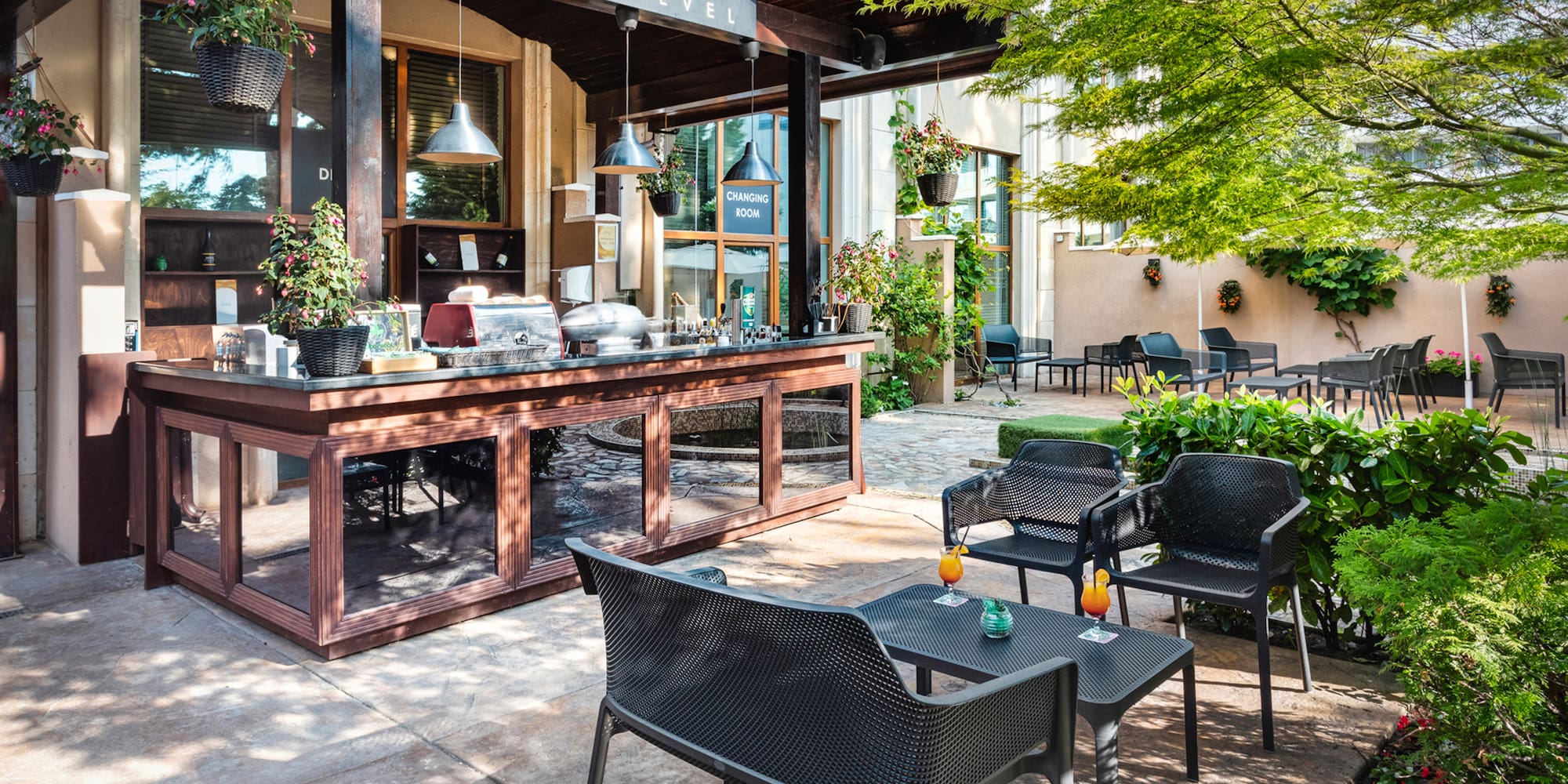 a patio with chairs and tables