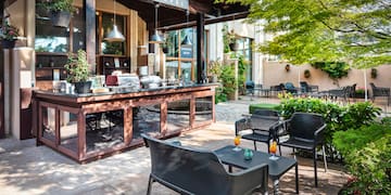 a patio with chairs and tables