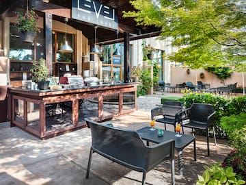 a patio with chairs and tables