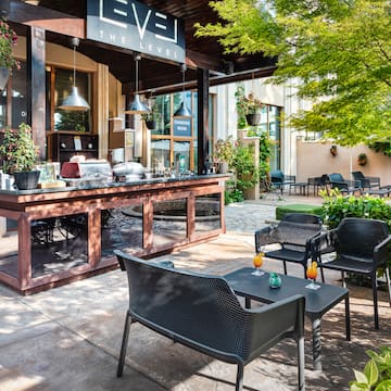 a patio with chairs and tables