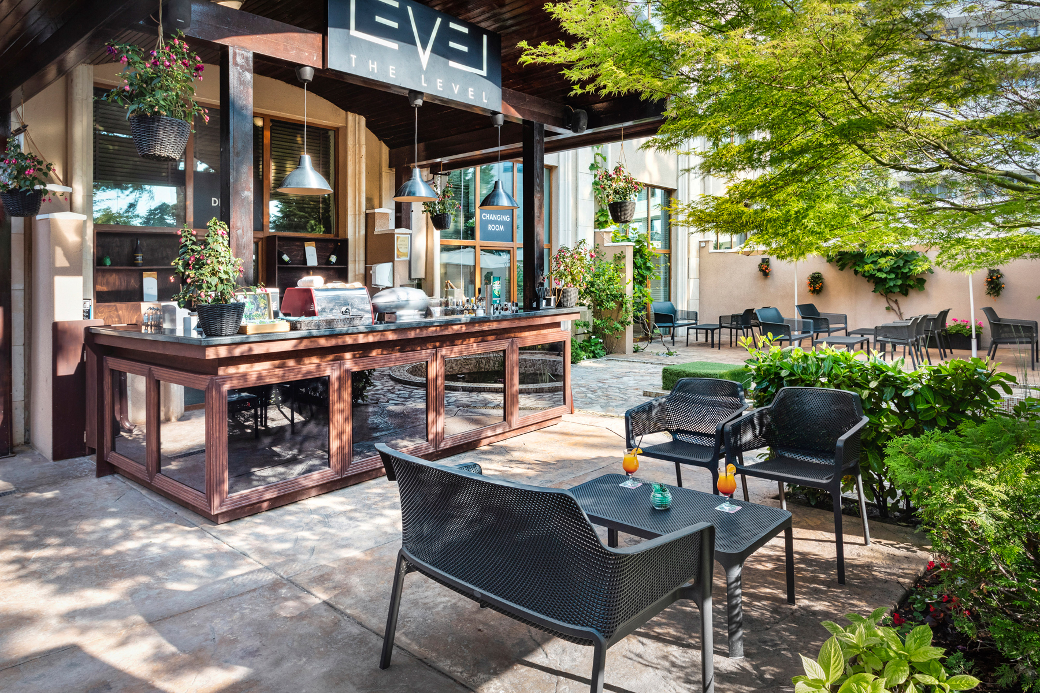 a patio with chairs and tables