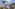 Tenerife resort with palm trees and Teide volcano.