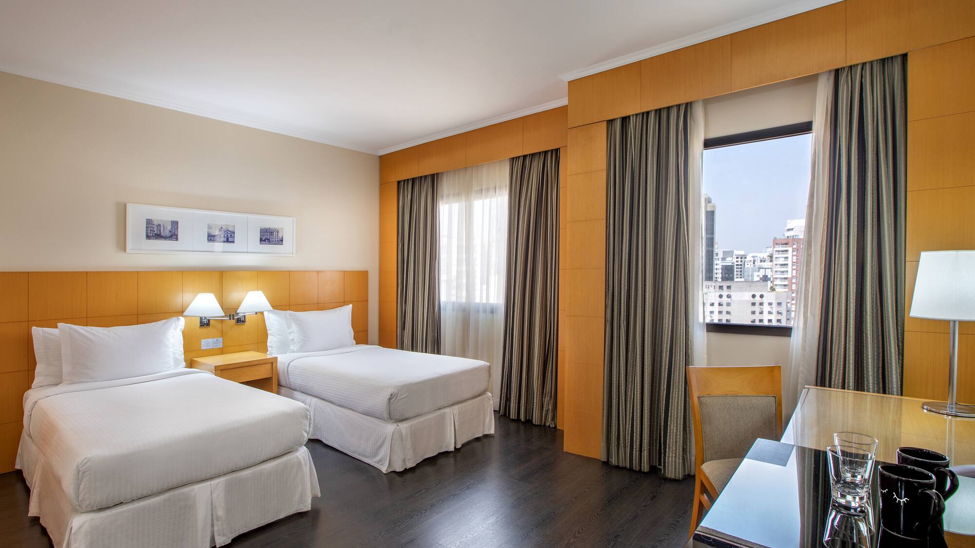 a room with two beds and a table