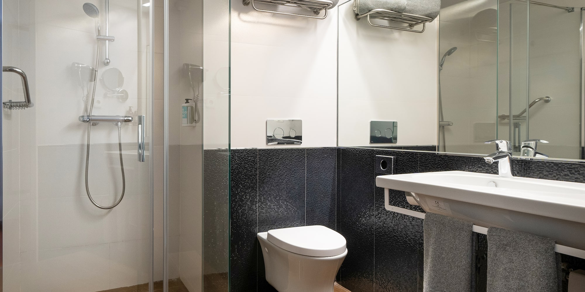 a bathroom with a shower and toilet