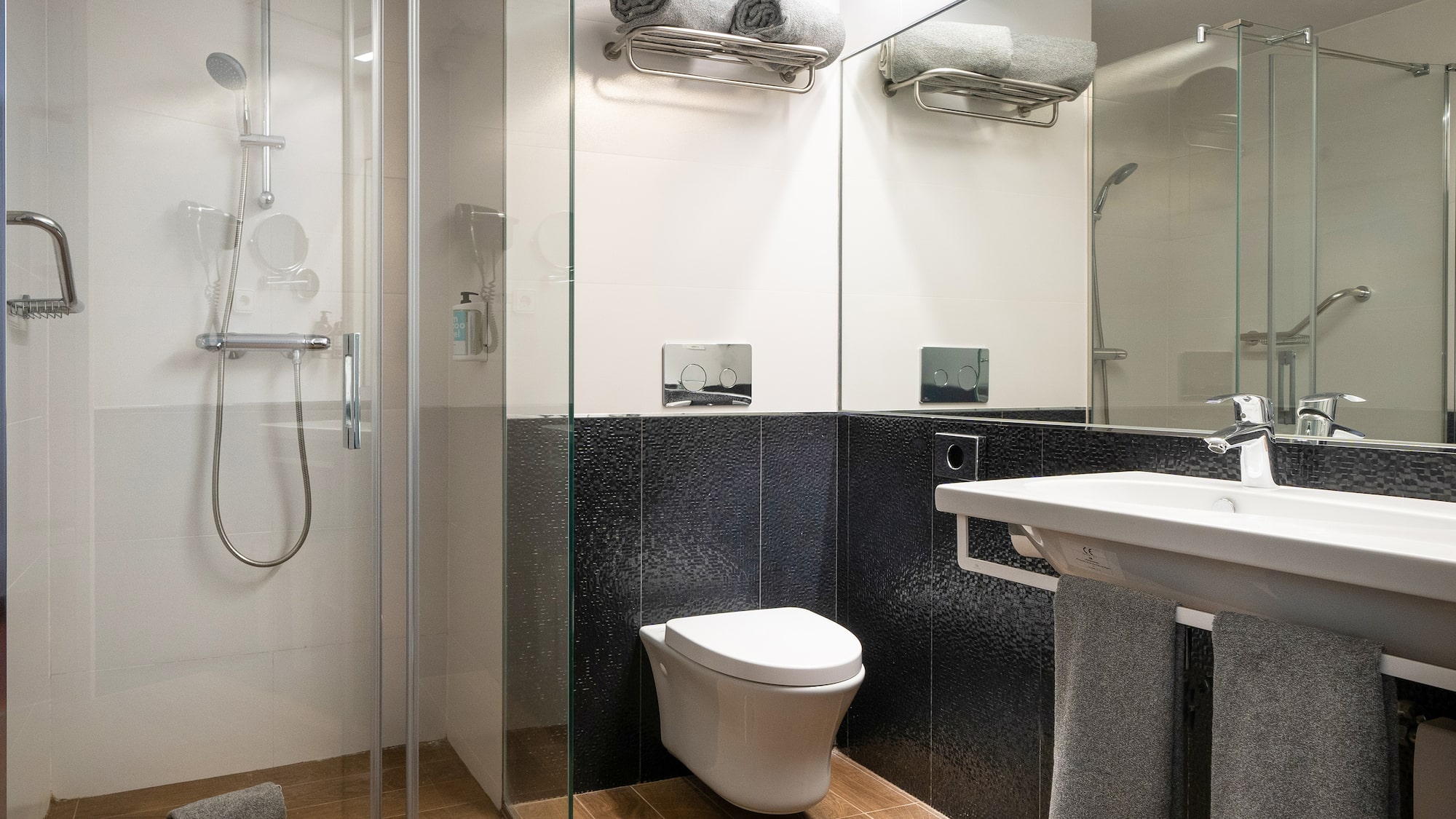 a bathroom with a shower and toilet