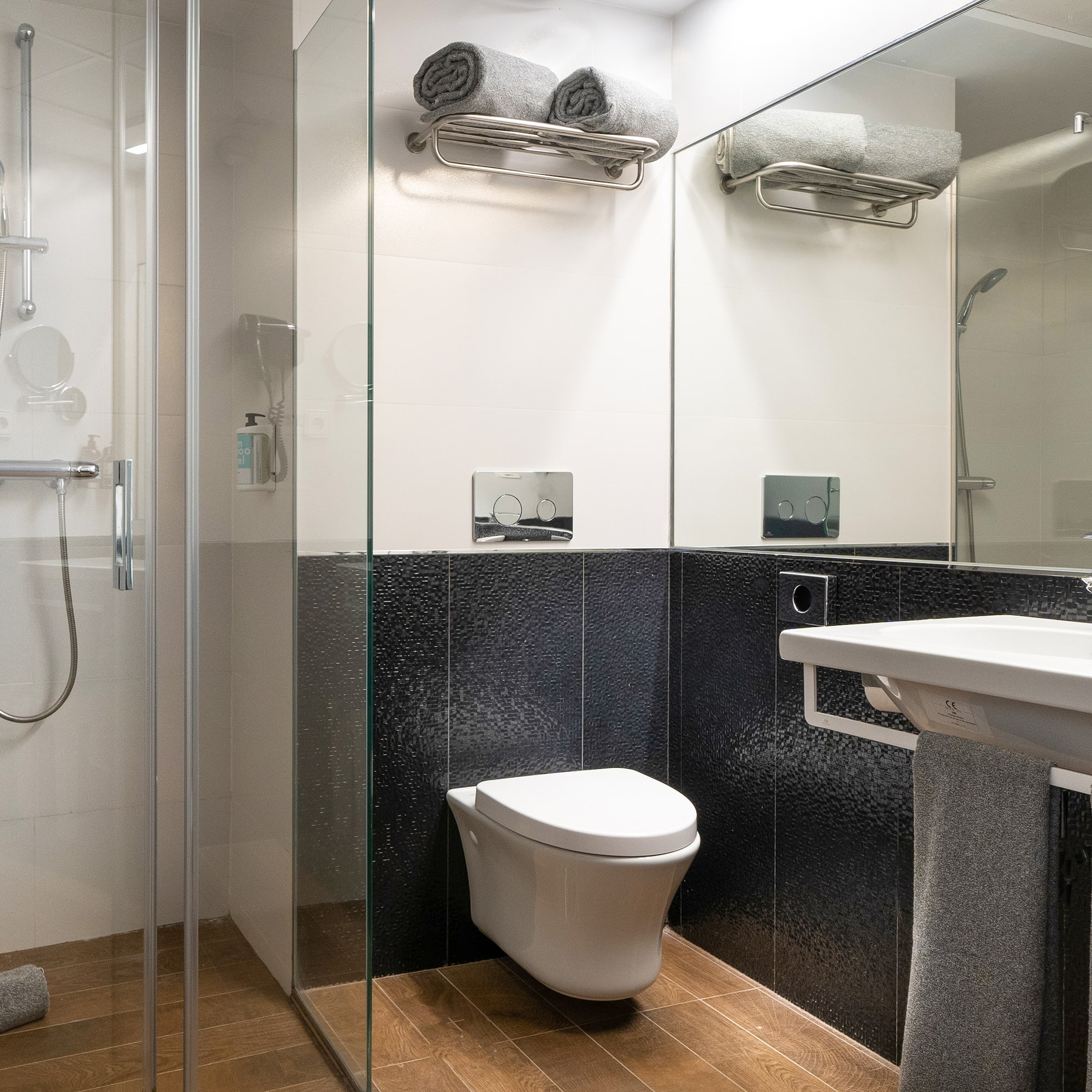 a bathroom with a shower and toilet