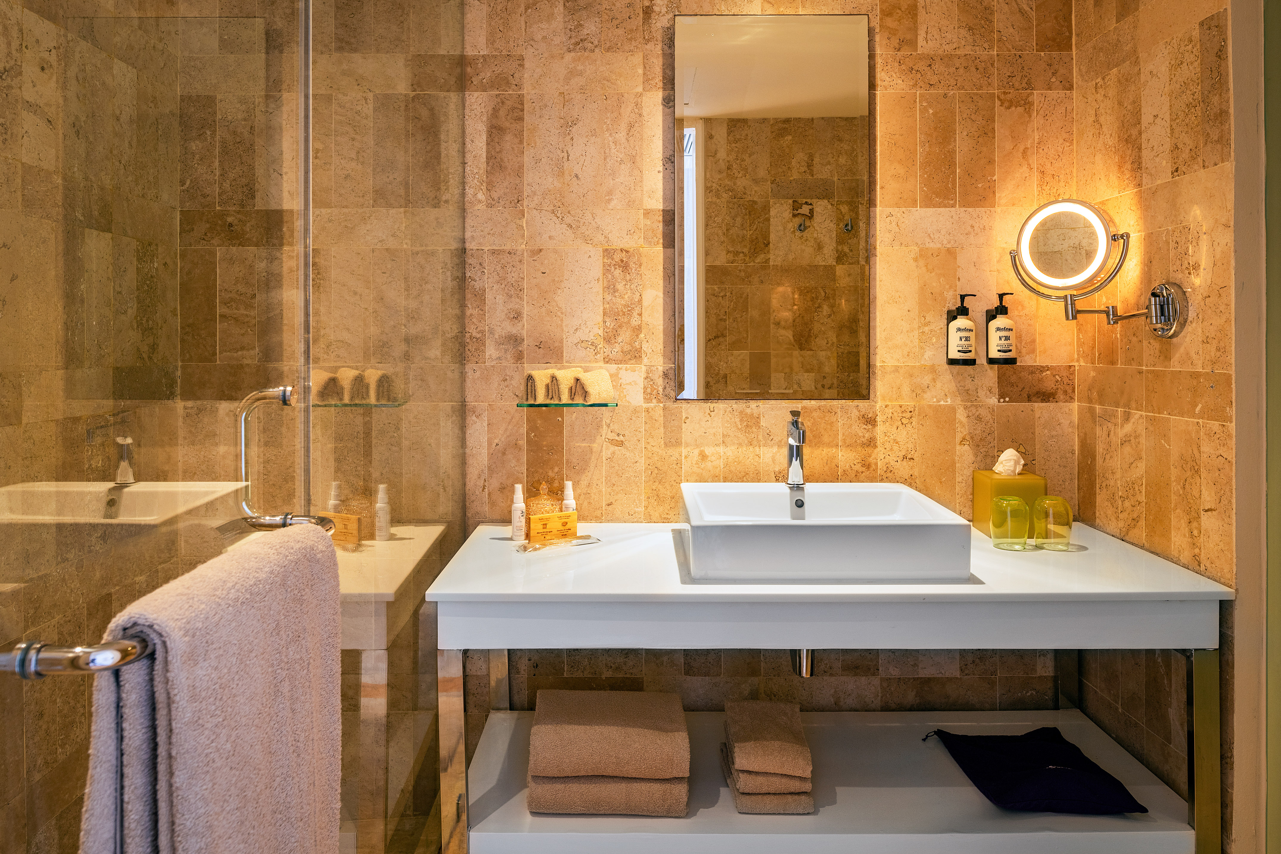 a bathroom with a mirror and sink