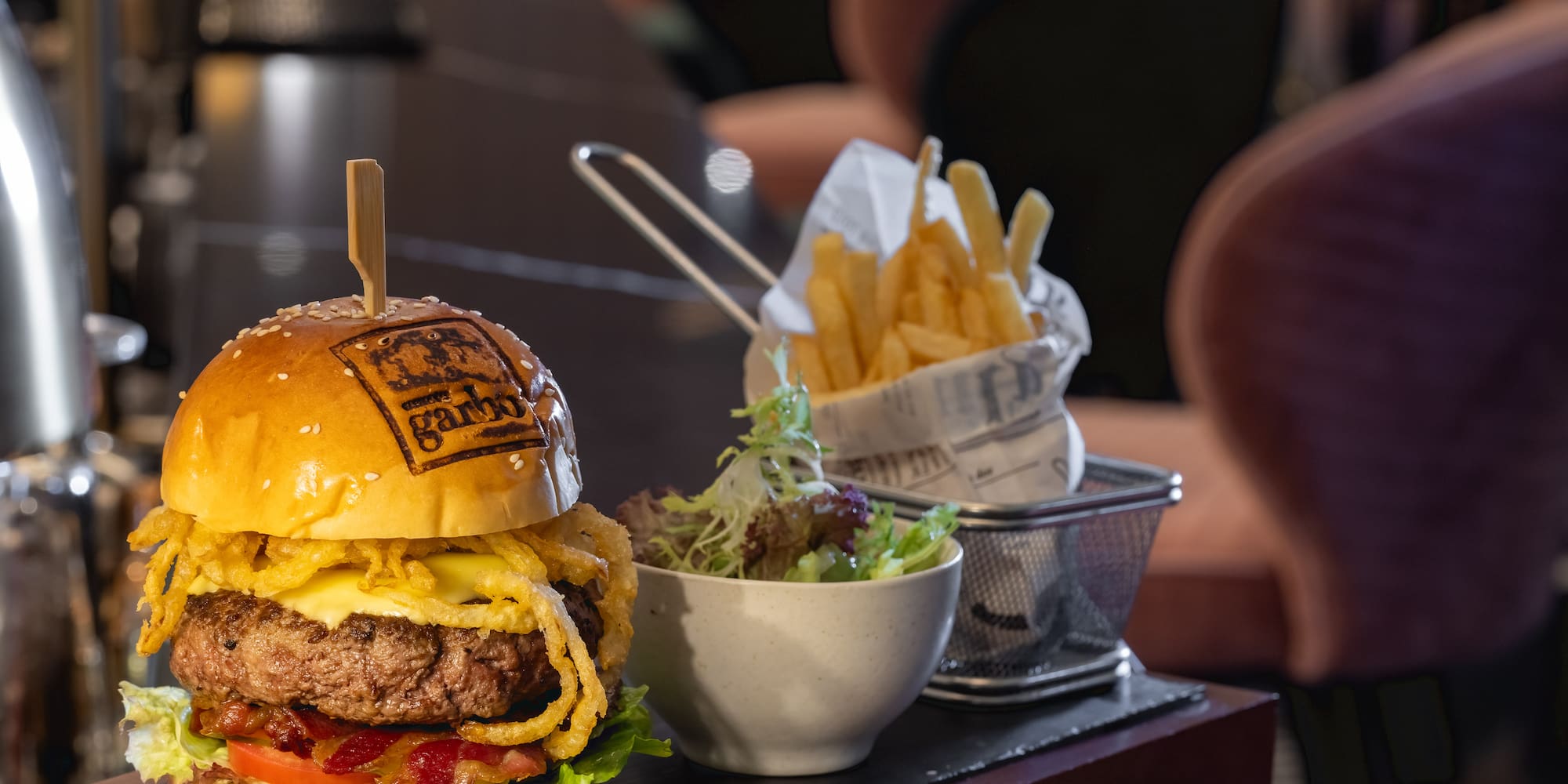 a burger and fries on a table