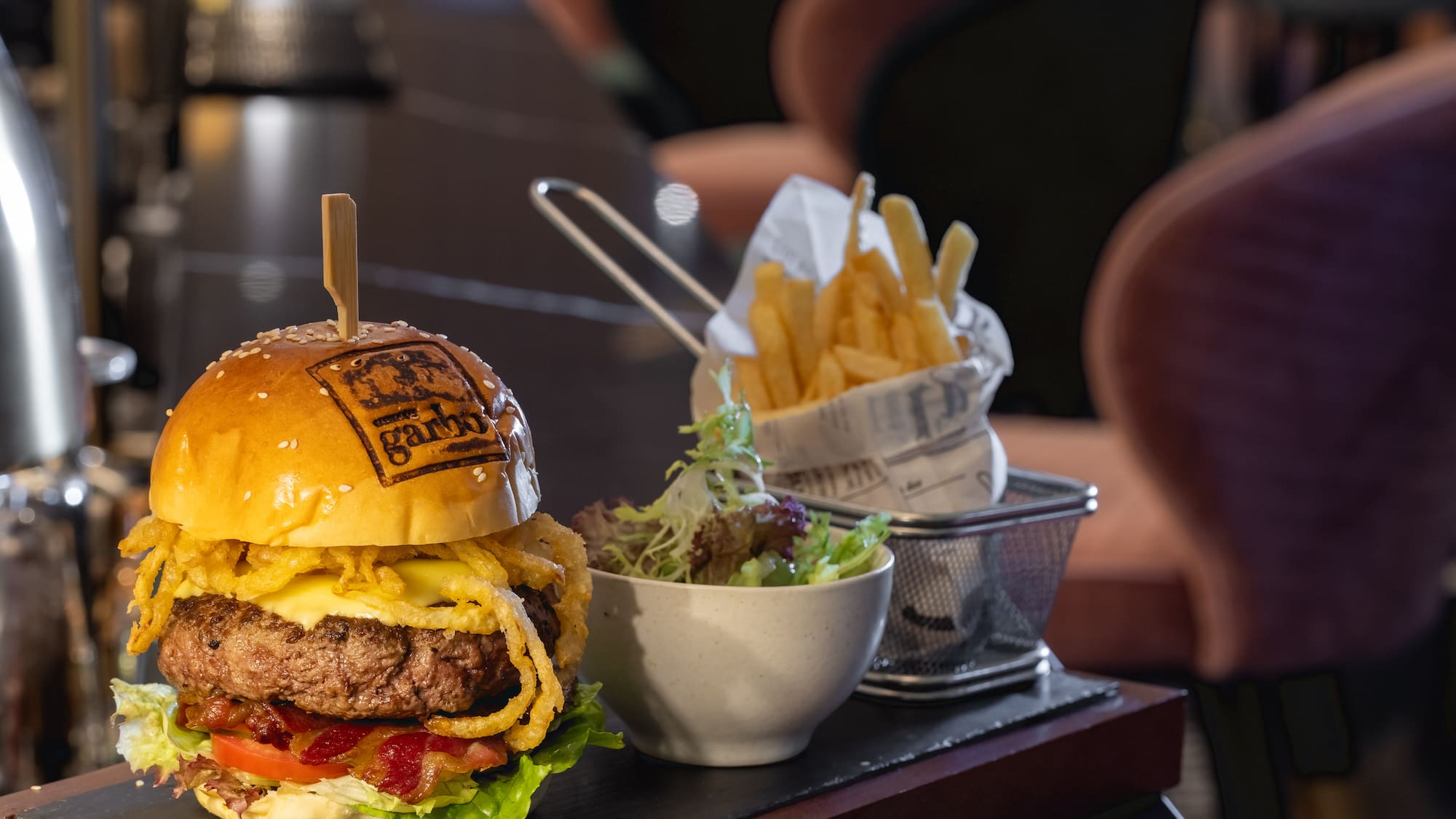 a burger and fries on a table