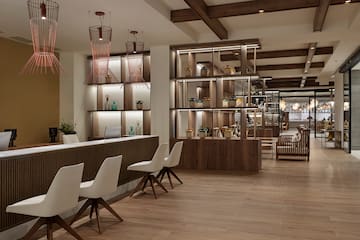 a room with a counter and chairs