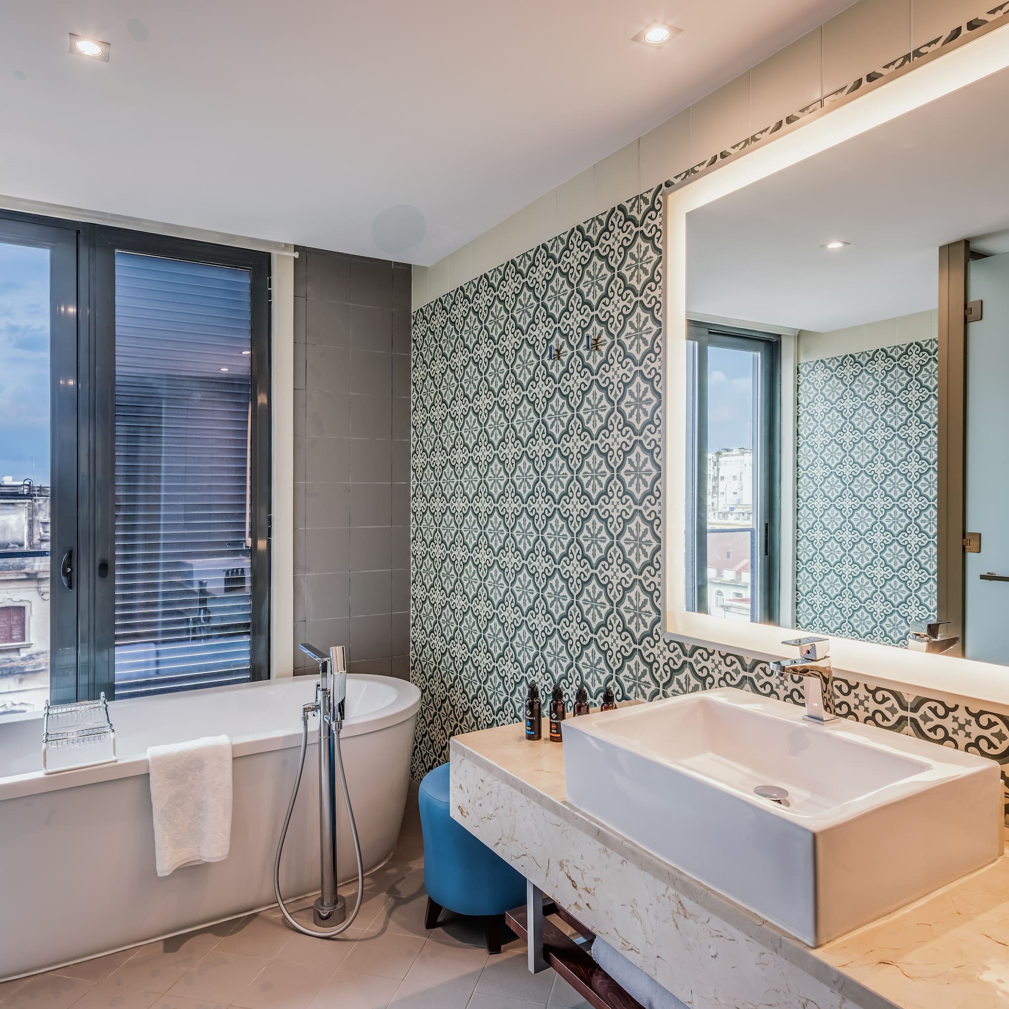 a bathroom with a tub and sink