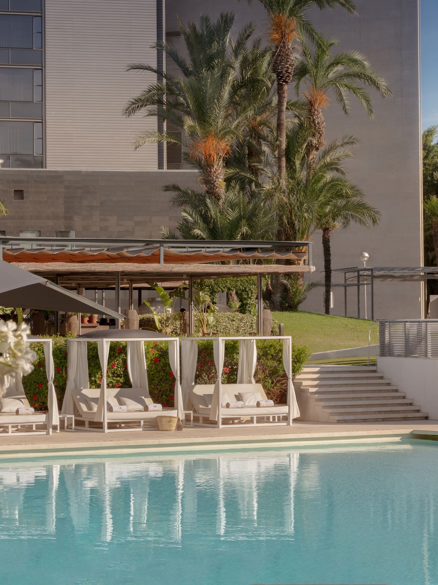 a pool with a building in the background