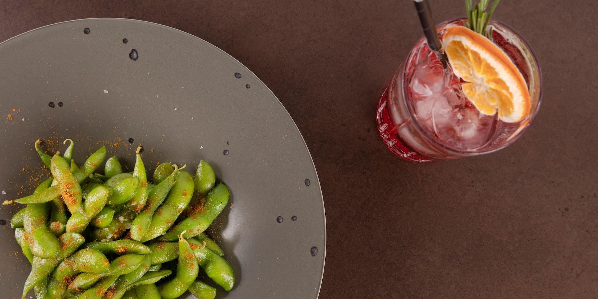 a plate of food next to a drink