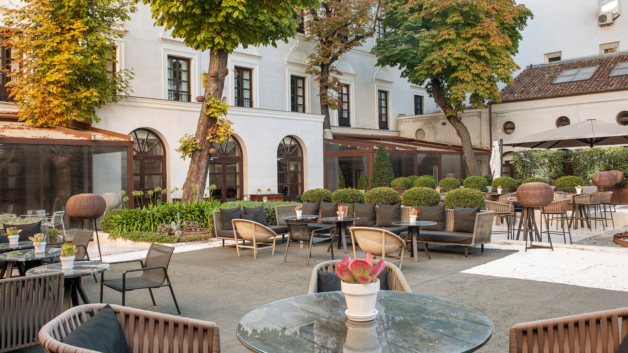 a patio area with chairs and tables