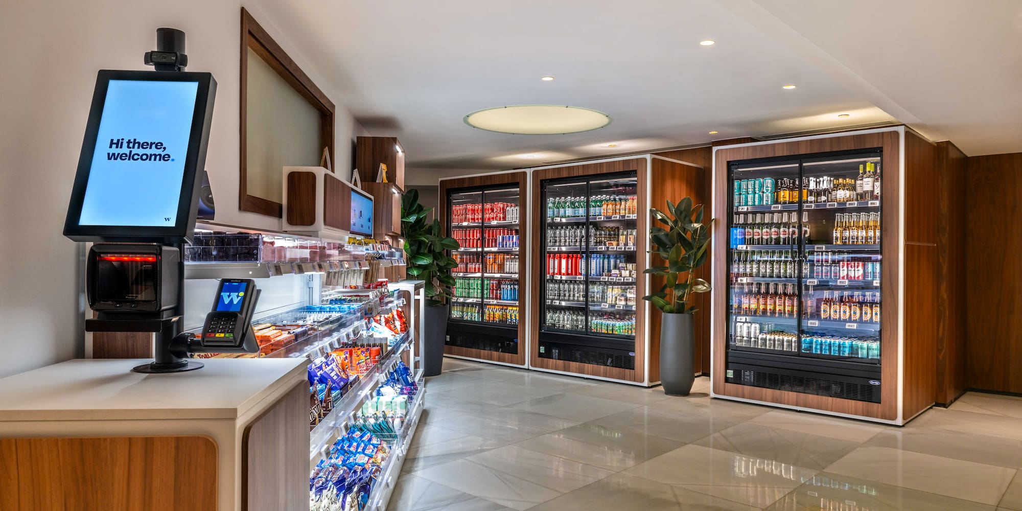 a room with a beverage cooler and a computer