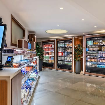 a room with a beverage cooler and a computer