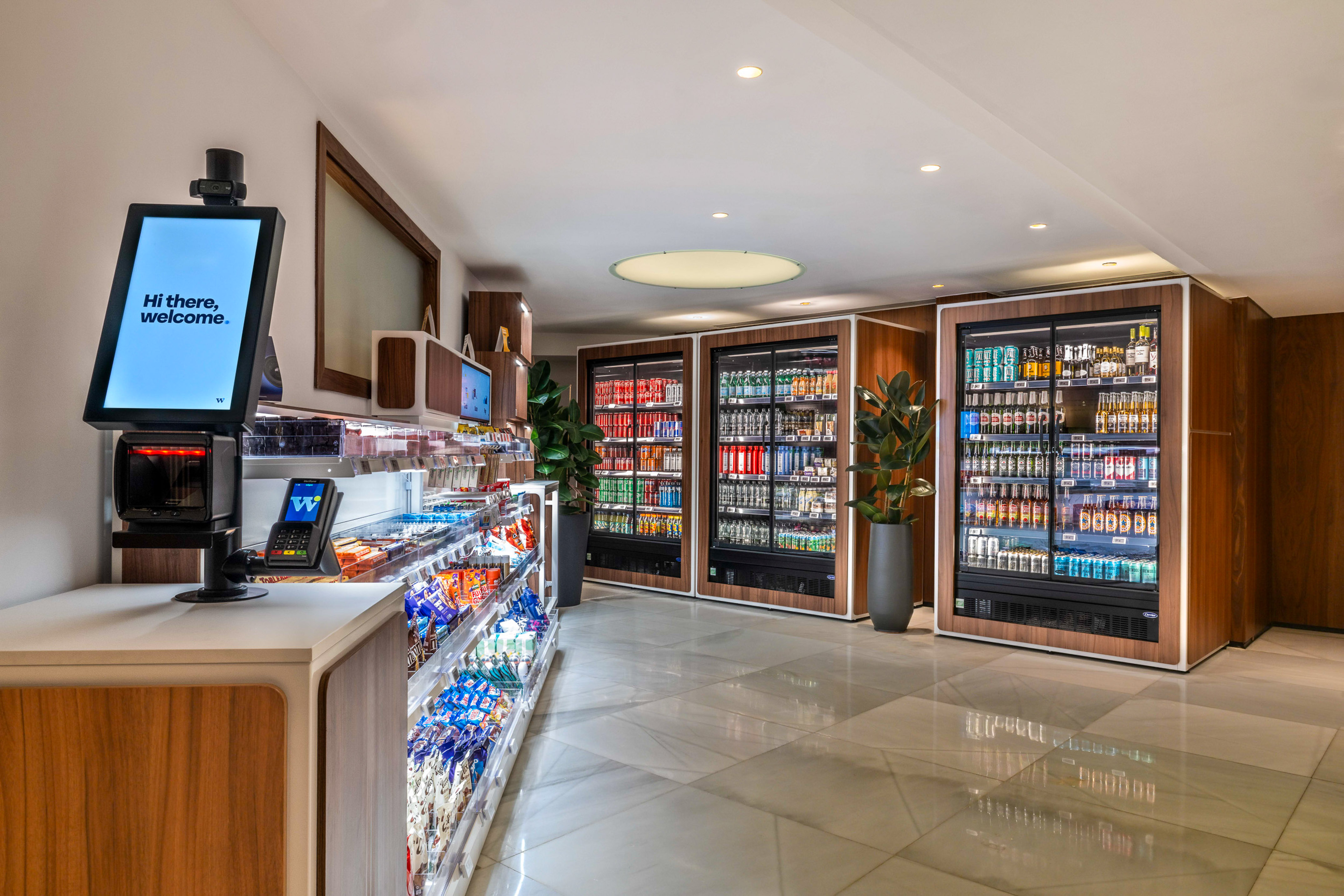 Smart micro-market with self-checkout, snacks, and cold beverages.