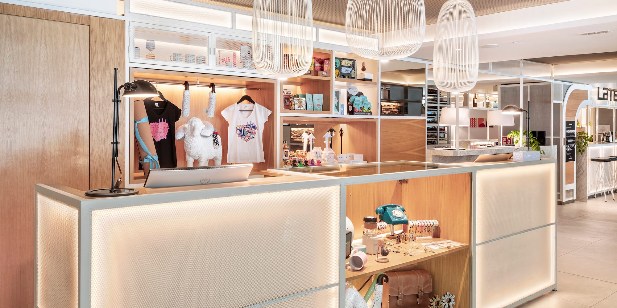 a counter with a light fixture and a shelf with items