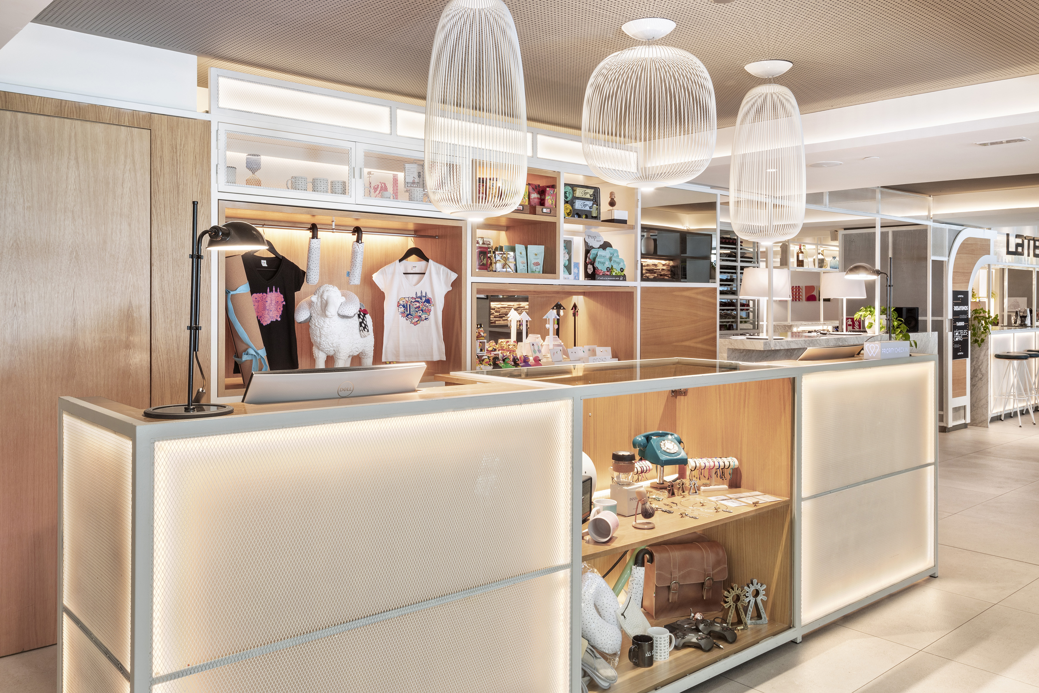 a counter with a light fixture and a shelf with items