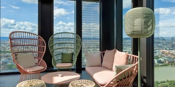 a room with wicker furniture and a table