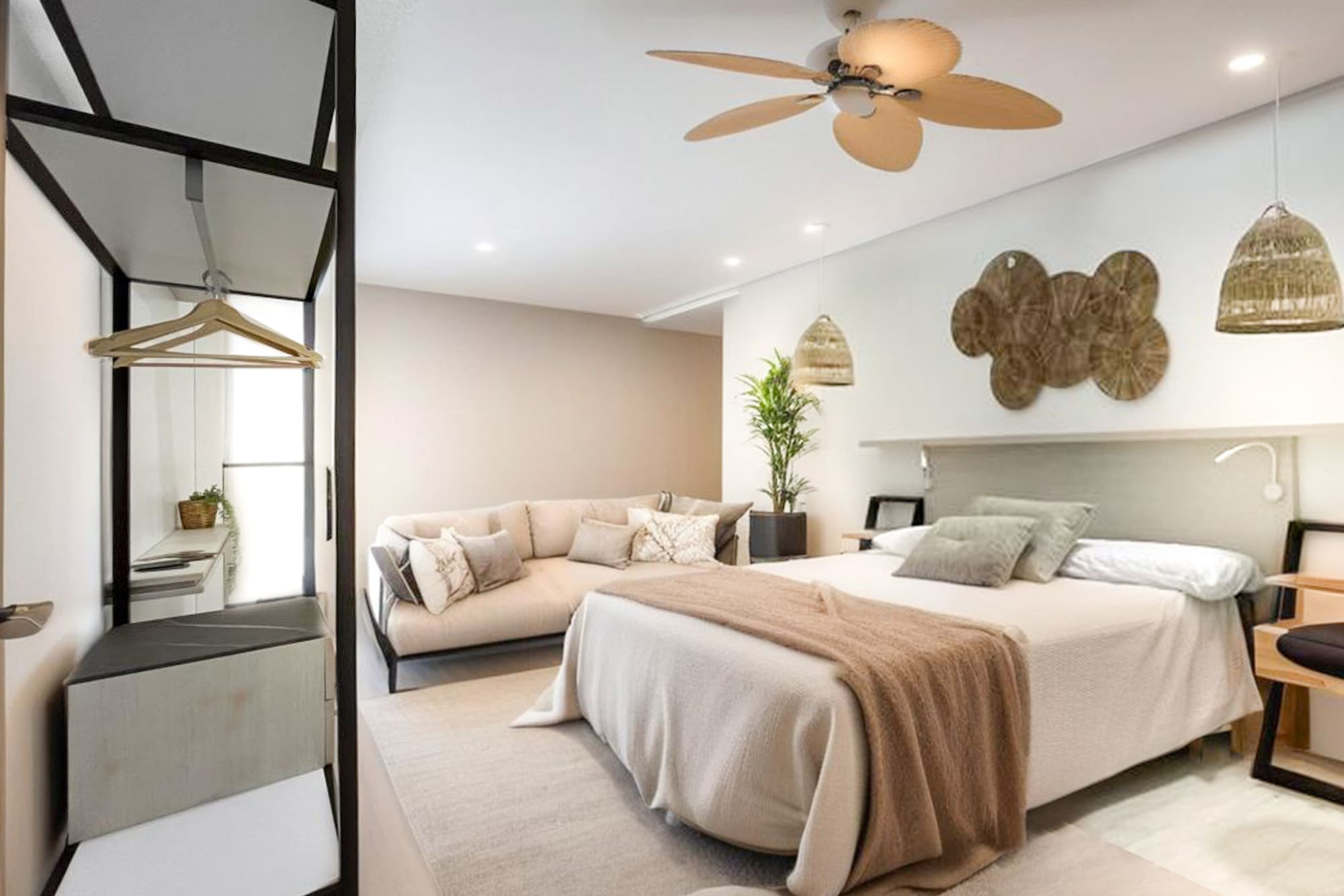 a bedroom with a large bed and a couch