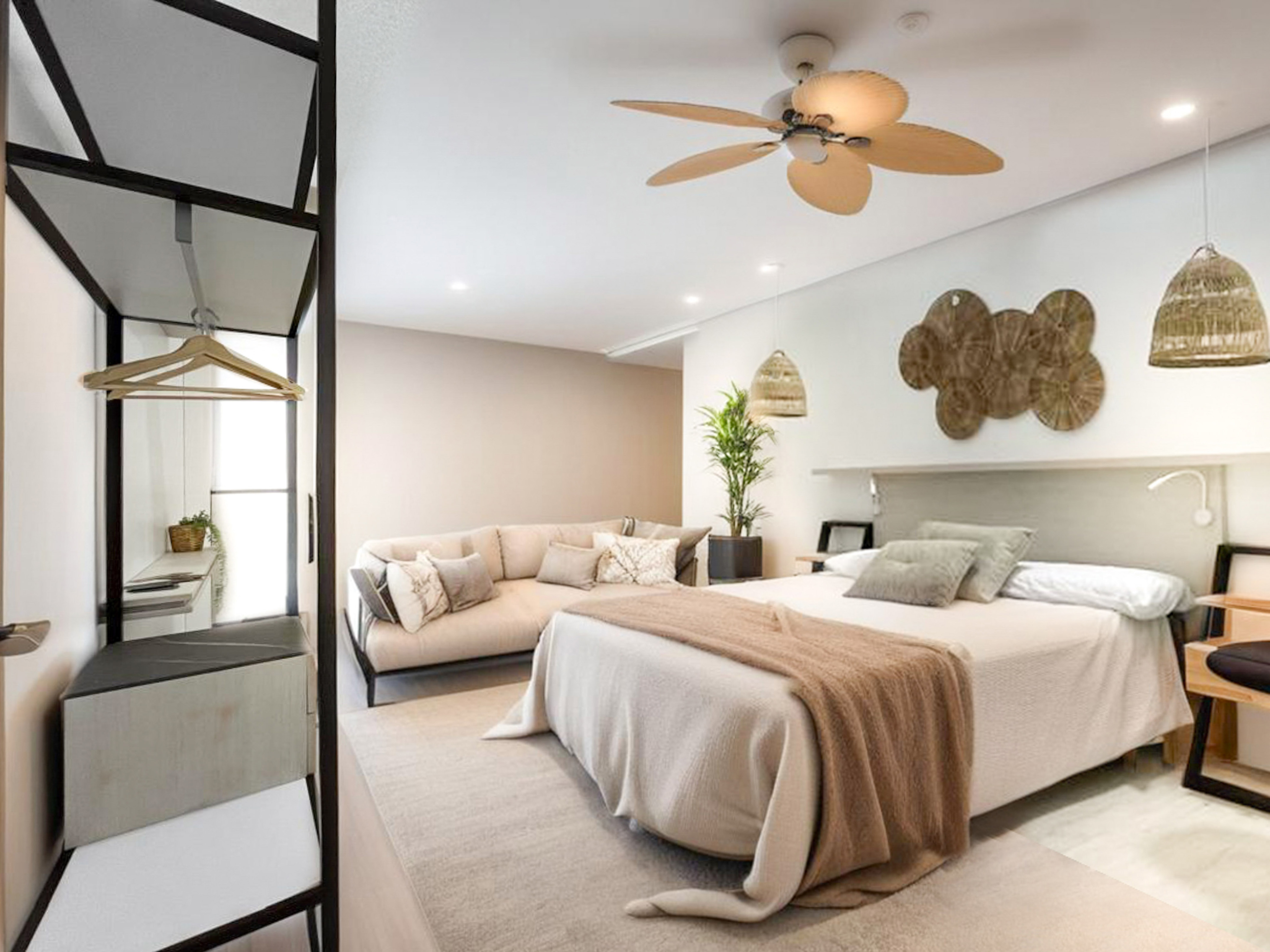 a bedroom with a large bed and a couch