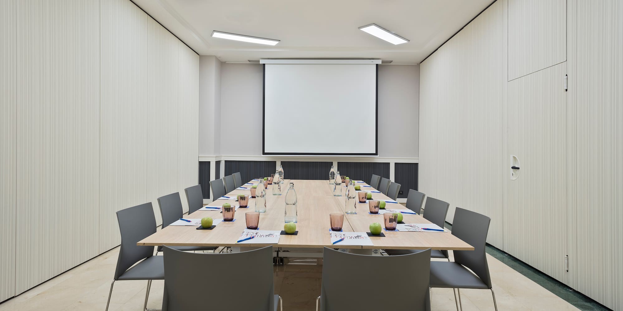 a conference room with a table and chairs