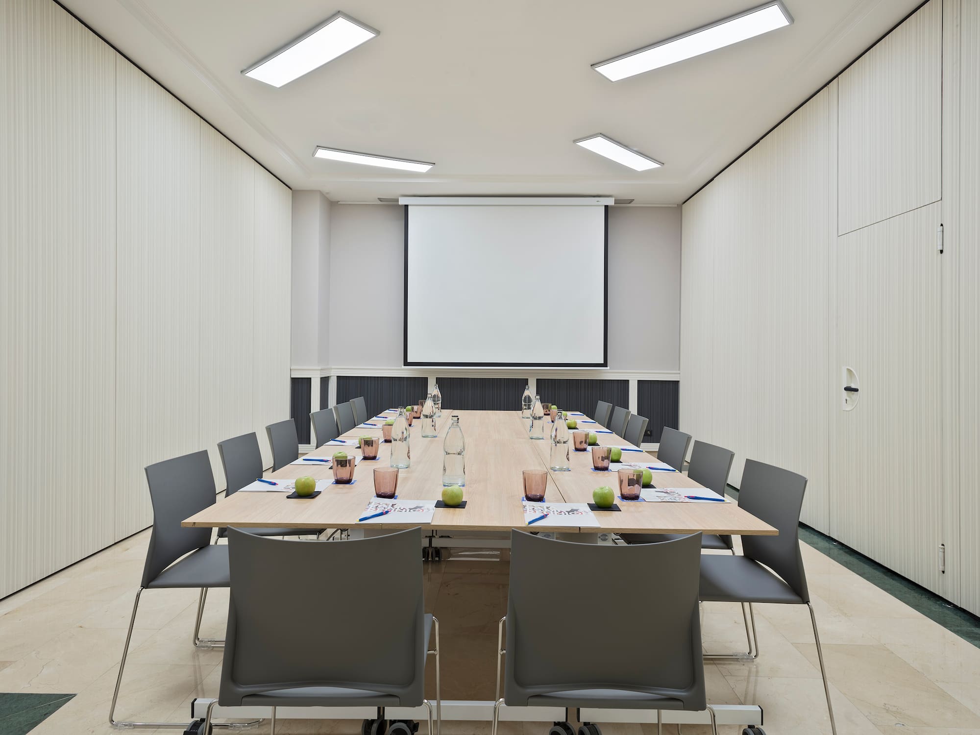a conference room with a table and chairs