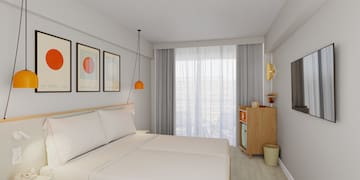 a bedroom with a bed and a dresser