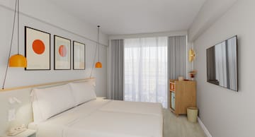 a bedroom with a bed and a dresser