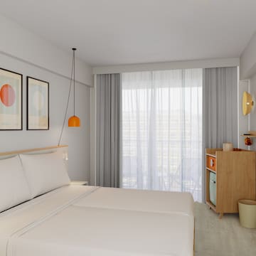 a bedroom with a bed and a dresser