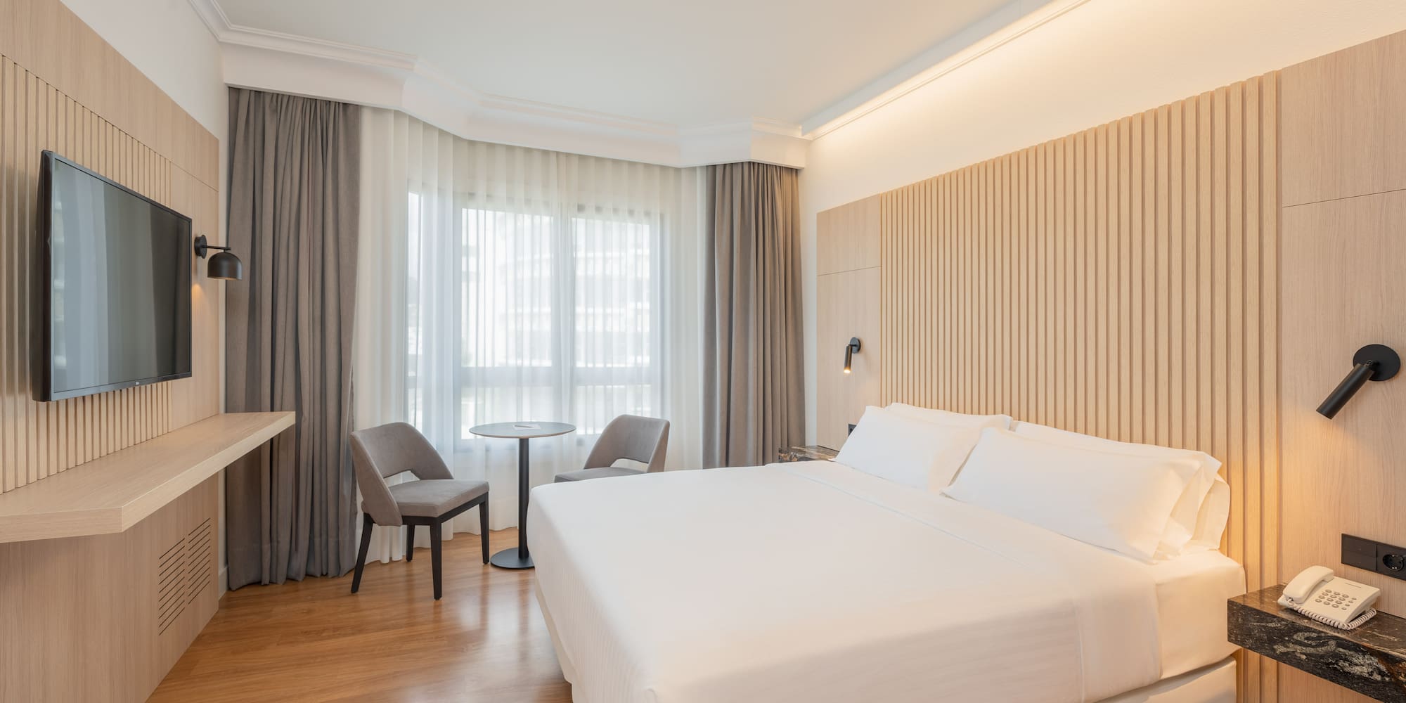 a room with a bed and a desk